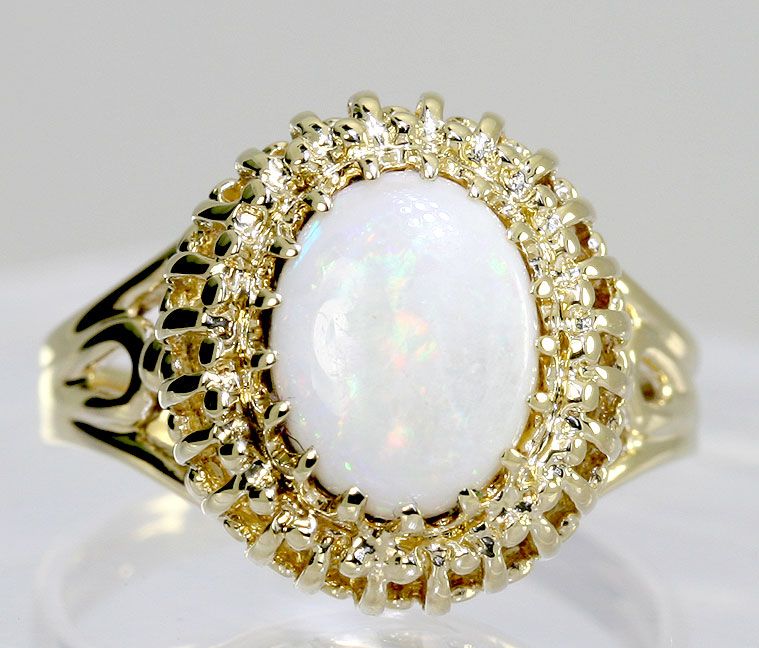   this is a lovely opal and 10k yellow gold ring measuring 5 8 inch long